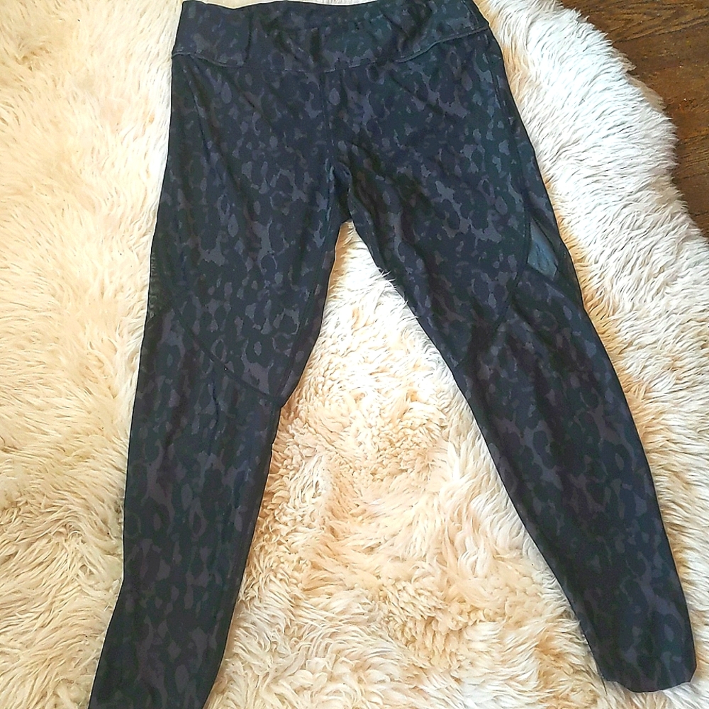 Alala yoga pants. Zipper pocket back waist. Filmy net strip outer lower thigh